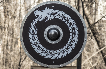 Handcrafted wooden Viking shield with iron boss and Norse knotwork design